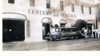 Lester's Service station, vintage photograph of the storefront with the Goodyear World's Largest Tire car.